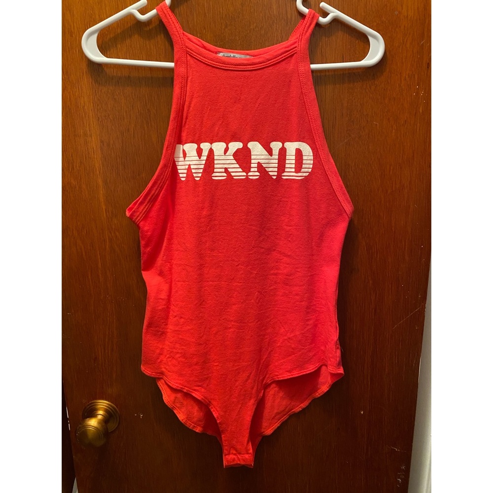 Women’s bodysuit orange size small never worn.